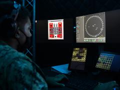 A seaman tracks surface contacts in a simulated combat information center within a virtual operational trainer. The Navy is increasing its focus on virtual training as part of a major push for advanced information warfare. U.S. Navy photo