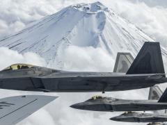 U.S. Air Force F-22 Raptors fly alongside an Air Force KC-135 Stratotanker during training near Mount Fuji, Japan, earlier this year. U.S. Indo-Pacific Command is building a mission partner environment that will allow greater interoperability between U.S. forces and international partners and allies in the region. Credit: Air Force Senior Airman Rebeckah Medeiros