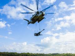 U.S. Marines with the 1st Battalion, 12th Marine Regiment and Marine Heavy Helicopter Squadron 463 use a CH-53-E to lift an M777 Howitzer in Hawaii in January. The Marine Corps is developing a different kind of regiment, called the Marine Littoral Regiment, to perform expeditionary, advanced base operations. Credit: USMC, 1st Battalion