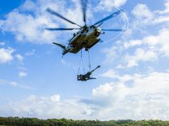 U.S. Marines with the 1st Battalion, 12th Marine Regiment and Marine Heavy Helicopter Squadron 463 use a CH-53-E to lift an M777 Howitzer in Hawaii in January. The Marine Corps is developing a different kind of regiment, called the Marine Littoral Regiment, to perform expeditionary, advanced base operations. Credit:  USMC, 1st Battalion