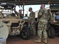 In April 2021 at Wheeler Army Airfield, Hawaii, Staff Sgt. Christopher Watson, USAF, 25th ASOS Radio Frequency Transmissions craftsman (l), speaks with Gen. Ken Wilsbach, USAF, Pacific Air Forces (PACAF) commander (c) and Chief Master Sgt. David Wolfe, USAF, PACAF command chief, about the 25th ASOS’ joint all-domain command and control (JADC2) capabilities. Authors of a new study are warning about the growing risks of JADC2 on space-based solutions. Credit: U.S. Air Force photo by Tech. Sgt. Nick Wilson