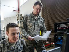 U.S. Airmen with the 1st Combat Communications Squadron review their systems against technical guides during a cybersecurity audit in March at Ramstein Air Base, Germany. Photo by Staff Sgt. Timothy Moore, USAF