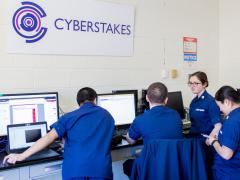U.S. Coast Guard Academy cadets discuss strategy during a 2016 Cyber Defense Exercise, a competition between service academies conducted by the National Security Agency. U.S. Coast Guard photo by Petty Officer 2nd Class Richard Brahm, USCG