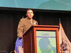 Brig. Gen. Dennis Crall, USMC, director C4/CIO, speaks at MILCOM in Baltimore.