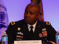 Maj. Gen. Bruce Crawford, USA, commanding general of the U.S. Army Communications-Electronics Command, speaks at MILCOM 2016. Photo by Mike Carpenter