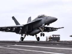 An F/A-18F Super Hornet aircraft lands on the flight deck of the aircraft carrier USS Theodore Roosevelt in the Persian Gulf, December 2, 2017. The Navy just tapped BAE Systems to produce integrated defensive electronic countermeasures for the F/A-18E-F aircraft platform. Navy photo by Petty Officer 3rd Class Rachael Treon.