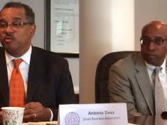 Antonio Doss (l), district director of the SBA’s Washington Metropolitan Area District Office, talks about a major rule change during AFCEA's Small Business Committee meeting.
