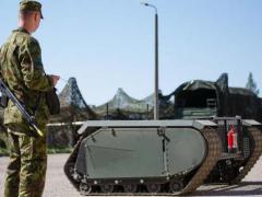 An Estonian soldier tests the THeMIS unmanned ground vehicle during a spring battlefield exercise.
