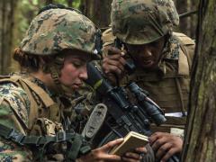 A Marine radios in after contact with a simulated enemy during a training exercise in Shizuoka, Japan. The Defense Department has mandated a new software architecture standard for tactical radios. Credit: Marine Corps photo by Lance Cpl. Aaron Henson