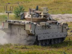 The Mission Enabling Technologies Demonstrator manned vehicle can operate two unmanned platforms to make contact with the enemy before soldiers do, while achieving overmatch against future operating environment threats. The Army’s vision includes three robotic vehicle variants—light, medium and large, but service officials have decided for now to cancel the acquisition of a medium variant. U.S. Army photo by Jerome Aliotta/Released