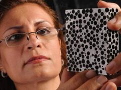 Afsaneh Rabiei examines a sample of composite metal foam. Her pioneering research has led to armor plating that weighs far less than steel and is capable of stopping armor-piercing .50-caliber bullets. Credit: North Carolina State University