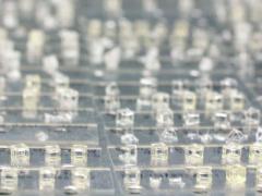 By using laser-generated, hologram-like 3-D images flashed into photosensitive resin, researchers can build complex parts in a fraction of the time of traditional layer-by-layer printing. Credit: Lawrence Livermore National Laboratory