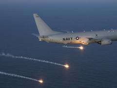 A P-8A Poseidon test aircraft completes a flare launch during a countermeasures test over the Atlantic Test Range. The P-8A participates in the Defense Exportability Features program, which is intended to identify exportability issues early in a system’s development, saving time and money in the future.