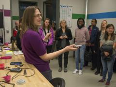 Caroline Scheck, a mechanical engineer with the Additive Manufacturing Project Office, tells middle- and high-school students with the Washington, D.C., Girls in Technology program about the Manufacturing, Knowledge and Education Lab, Naval Surface Warfare Center in March. (U.S. Navy photo by Dustin Q. Diaz/Released)