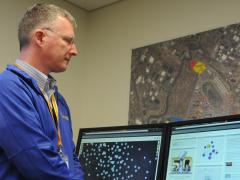 Rob Kerr, chief software architect for Haystax Technologies, demonstrates a predictive analytics tool used to deliver high fidelity threat assessments for Super Bowl 50.