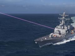 Under the High-Energy Laser and Integrated Optical-dazzler with Surveillance (HELIOS) program, the Navy is swiftly pursuing laser weapons for use on surface ships. The technology will combine the lethality of a laser weapon with surveillance capabilities and an integrated optical dazzler, a non-lethal device that disables sensors or humans visually. Photo Credit: Lockheed Martin, artist rendering of Lockheed Martin’s HELIOS System
