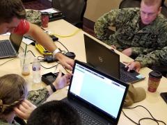 U.S. Navy sailors collaborate with Naval Information Warfare Center Pacific’s RESTORE Lab to explore how three-dimensional scanning and printing can deliver an effective and reliable solution to repair critical warfighting equipment. U.S. Navy photo by Cmdr. John P Fagan /Released
