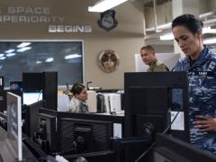 Squadron Leader Jamiee Maika, Royal Australian Air Force, observes operations at the Combined Space Operations Center at Vandenberg Air Force Base, California. This multinational space force includes a strategic defense partnership between the United States, Canada, Australia and the United Kingdom. Additional nations collaborating on space operations with the center include Germany, France and New Zealand. U.S. Space Force photo by Staff Sgt. J.T. Armstrong