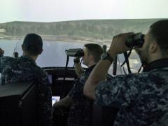 Sailors assigned to the Gold crew of the guided-missile submarine USS Ohio test the new submarine bridge trainer at Trident Training Facility Bangor in Washington.
