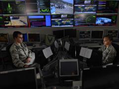 Two U.S. Air Force space and cyber airmen work in the Global Strategic Warning and Space Surveillance Systems Center at Cheyenne Mountain Air Force Station, Colorado. The Air Force aims to change the nature of its cyber work force as it transitions deeper into the information age.