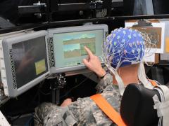 Scientists at the Army Research Laboratory (ARL) monitor a soldier’s brainwaves as he operates systems in a simulated tank. The work seeks to understand thought patterns and physical states during combat pursuant to teaming the soldier with artificial intelligence.