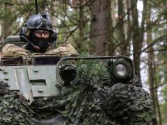 A soldier with the 1st Infantry Division provides security during exercise Allied Spirit VII in Hohenfels, Germany. In the future, the trees surrounding the soldier may be used as networked sensors if work underway at the Army Research Laboratory (ARL) bears fruit.