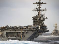 The aircraft carrier USS Theodore Roosevelt transits the Pacific Ocean with the USS Russell and the USS Paul Hamilton. The U.S. Navy is facing several challenges as it strives to modernize its information technology across the breadth of its sea and land assets. U.S. Navy photo