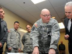 Tennessee’s adjutant general, Maj. Gen. Terry “Max” Haston of the Army National Guard, reviews a map of Bulgaria’s area of operation with Bulgarian Armed Forces cybersecurity officials at Tennessee’s Joint Force Headquarters in 2014. Bulgaria is investing in a national cyber defense system and collaborating with the U.S. government to mirror efforts such as optimizing public-private partnerships.