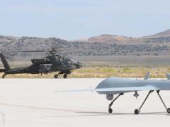 The OH-58D Kiowa Warrior, AH-64D Apache Longbow and Warrior Alpha land at Michael Army Airfield, Utah, in 2011, after the Manned-Unmanned Systems Integration Capability exercise. The aircraft joined with the RQ-11B Raven and MQ-5B Hunter to demonstrate their interoperability.