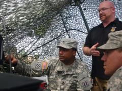 U.S. soldiers and an electronic warfare (EW) trainer observe the spectrum of frequencies used for communications during the Marne Focus exercise in June. A group of EW personnel test reaction times by jamming their communications during the exercise.