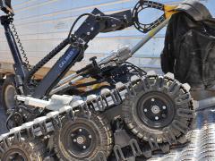 A bomb disposal robot removes a suspicious package during a training operation at Sandia National Laboratories. (Photo by Randy Montoya)
