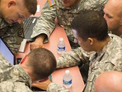 Gathering around a single laptop, soldiers from Team National Guard map out a strategy to win the U.S. Army’s Cyber Center of Excellence’s multiservice NetWar competition in 2014. The exercise was created to build the cyber operators’ capabilities in the new warfighting domain.