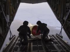 One way international military and government agencies gather information about weather and oceanographic data to enhance forecasting and environmental models is through networked buoys. The Royal Danish Air Force deployed these ice-hardened buoys from a C-130 into the Arctic Ocean in September as part of the International Arctic Buoy Program. Credit: John F. Williams