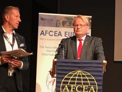 AFCEA Regional Vice President Harri Larsson (l) speaks with Swedish Defense Minister Peter Hultqvist at TechNet Europe 2017 in Stockholm.