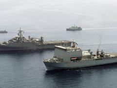 The USS Ponce (second ship in the foreground) once carried the first laser weapon demonstrator. Now the Navy will begin fielding a laser weapon and optic dazzler for for its Naval Sea Systems Command aboard a DDG 51 FLT IIA by 2020.