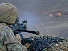 A soldier fires an M240B machine gun during combined arms live-fire training. Soldiers in combat face a great deal of emotional and physical stress, but wearable technologies can monitor their health and performance. Photo by Army Spc. Hannah Tarkelly