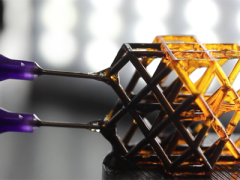 Researchers injected a magnetorheological (MR) fluid into hollow lattice structures built on LLNL’s Large Area Projection Microstereolithography (LAPµSL) platform, which 3D prints objects with microscale features over wide areas using light and a photosensitive polymer resin. Photo by Julie Mancini/LLNL