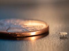 A micro-bristle-bot is shown next to a U.S. penny for size comparison. Credit: Allison Carter, Georgia Tech