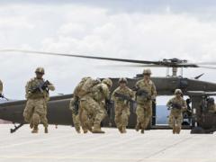 Soldiers from the 10th Mountain Division (LI) perform an air assault demonstration for President Trump during a visit to Fort Drum, New York, on August 13. The demonstration was part of the President’s ceremony to sign the National Defense Authorization Act of 2019, which authorizes funding for U.S. defense and military activities for Fiscal Year 2019. Photo credit: U.S. Army photo by Sgt. Thomas Scaggs.