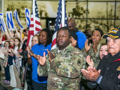 Veterans, active duty military and civilians welcome wounded warriors from all over the country to Huntsville International Airport in Alabama in commemoration of Veterans Week in November. Big data corporation Splunk is partnering with nonprofit veterans’ organizations to make a difference in getting veterans back to work. Army photo by Sgt. 1st Class Teddy Wade.