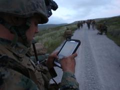 A U.S. Marine uses a tablet to communicate in real-time during the Infantry Officer’s Course.