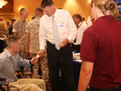 A service member networks with employers during the Hiring Heroes Career Fair at Marine Corps Base Camp Pendleton, California.