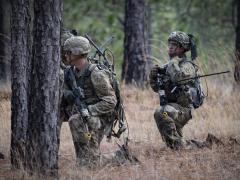 A team leader with 1st Battalion, 504th Parachute Infantry Regiment, directs movements of his team using the Harris Leader Radio during an assault on an objective during the initial operating test for the system. The rapid development and fielding of cutting-edge systems help drive the need for agility and adaptability at Army signal and cyber schools. Nicholas Robertson, U.S. Army Operational Test Command Visual Information Specialist