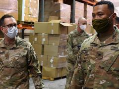 Gen. Joseph Lengyel (l), USAFG, chief of the National Guard Bureau, speaks with Col. Hall, USAG from the Louisiana National Guard during a 2020 tour of the state’s Public Safety warehouse supporting the COVID-19 response in Baton Rouge. The Space Force could have a guard component, but the Defense Department needs to complete a study on the viability. Credit: U.S. Air National Guard photo by Master Sgt. Toby Valadie