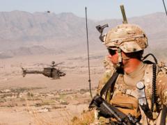 Capt. Jonathan Page, USA, uses the Rifleman Radio and Nett Warrior end user device of the Army’s Network Capability Set 13 at Nangalam Base, Afghanistan. Harris Corporation and Thales Defense and Security Incorporated have been awarded contracts to produce the radio system.