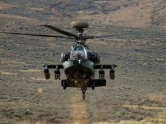 An AH-64 Apache rises from behind a hill during a training exercise at Yakima Training Center, Wash. Intevac Photonics was awarded a $12,626,081 firm-fixed-price contract with options for Electronic Image Intensifier Ship-Set for Lot 4, Apache AH-64D/E Program.