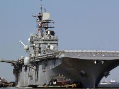 The amphibious assault ship USS Bataan (LHD 5) departs Naval Base Norfolk. It will be one of two ships to initially carry the Information Warfare Platform to sea. Photographer’s Mate 1st Class Shawn Eklund/U.S. Navy