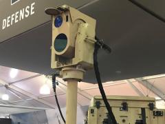 Appearing at the Modern Day Marine industry-related exhibits, Boeing’s compact laser weapon system is shown mounted on OshKosh Defense’s joint light tactical vehicle (JLTV). Credit: Kimberly Underwood