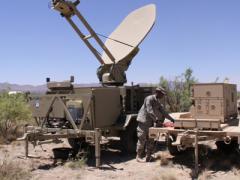 A U.S. Army soldier works with a power unit supplying a satellite antenna during an exercise. Military and civilian governments increasingly will benefit from future satellite network systems that are smaller, lighter and simpler and use less power.