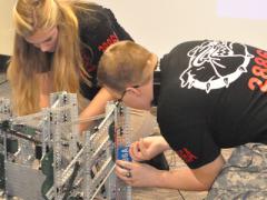 Students from Central Hardin High School in Cecilia, Kentucky, prepare their robotics entry for a Project Lead the Way (PLTW) competition. An AFCEA scholarship funded teacher training for PLTW—a leading provider of K-12 STEM programs—at the University